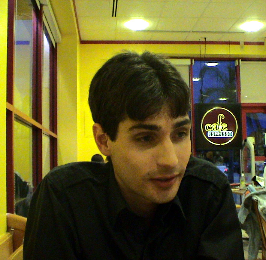 Boloby mid-sentence, inside the coffee shop.