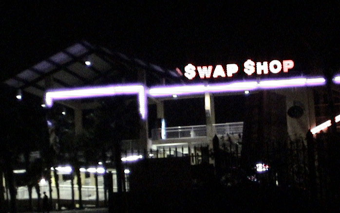 the creepy glow of the Swap Shop at night